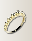 Anillo de bolitas con diamante