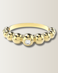 Anillo de bolitas con diamante