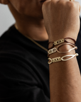 Odile men's bracelets with gold accents in brown, tan, and beige leather straps on wrist