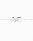 Brazalete de letras con diamante
