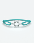 Odile herenarmband met zilveren ster en turquoise rubberen band voor een moderne uitstraling