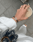 Zwart Odile armband in stervorm, perfect voor een stijlvolle mannenlook met een drankje